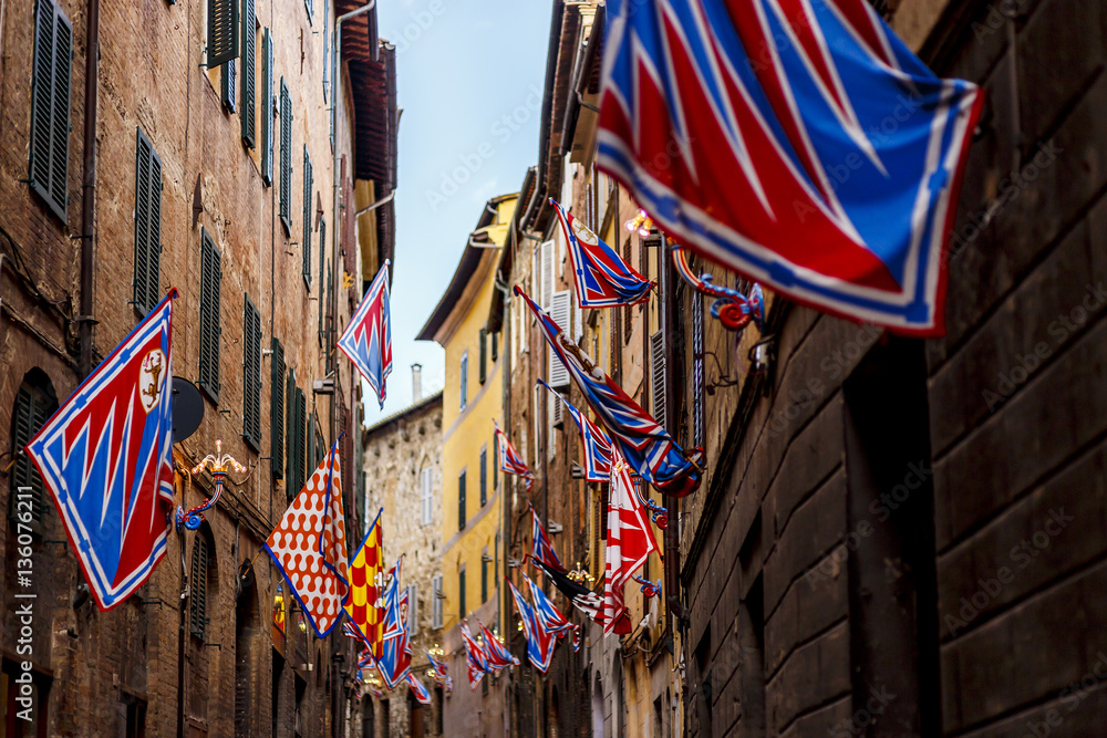 Banners of the contrads in Siena. Feast Palio. Region of Tuscany, Italy - obrazy, fototapety, plakaty 