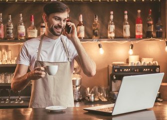 Wall Mural - Handsome barista working