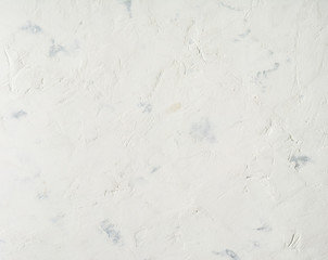 white background, lime plaster wall with scratches and irregularities