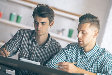 Poster - Attractive men doing paperwork