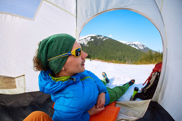 Wall Mural - hiker resting in the tent in the Carpathians mountains at winter