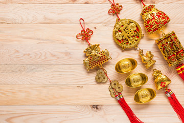 gold and red chinese new year decoration on wooden background