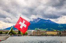 View Of Lake Lucerne In Summer Season With Swiss Flag, Switzerland