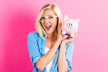 Sticker - Young woman with a piggy bank