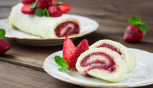 Slice Of Homemade Sweet Roll With Strawberry Jam And Berries
