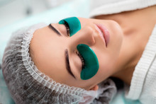 Cosmetic Procedure, The Woman's Face With Green Flakes Under The Eyes.