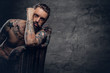 © Fxquadro - bearded male with naked tattooed torso.