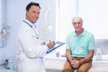 Wall Mural - Portrait of smiling doctor and senior patient