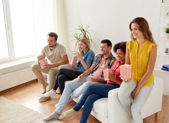 Sticker - happy friends with popcorn watching tv at home