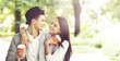 © Acronym - Young beautiful couple of hipsters: hugging in the park. Love, relationship, dating: concept.