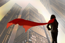 3D Illustration Of Business Woman Dressed In A Suit With A Cape Superhero On The Background Of Skyscrapers Of The City