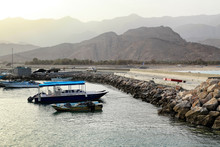 View On A Little Harbour In Oman During Sunset, Al Hajar Mountai