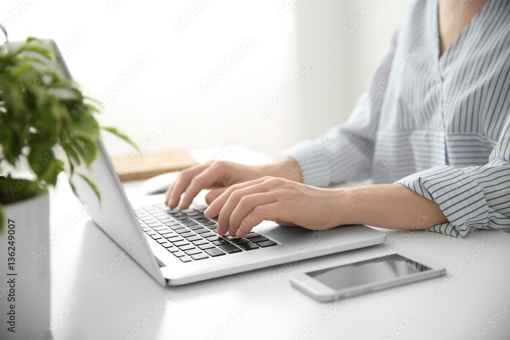 Woman working on computer at home