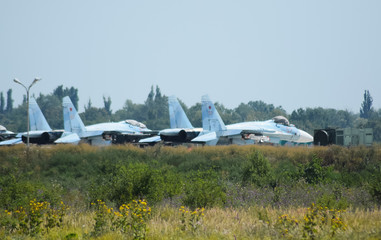 Wall Mural - Military airfield and parking lots of planes.