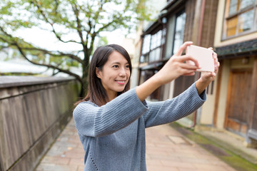 Sticker - Woman take photo by mobile phone in Kanazawa