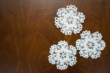 The Napkins Into Snowflakes, Crocheted From White Cotton Thread