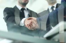Businessman Shaking Hands To Seal A Deal With His Partner