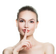 © artmim - Healthy Woman Holding her Finger to her Lips in a Gesture for Si