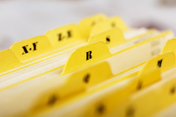 Close up of alphabetical index cards in box