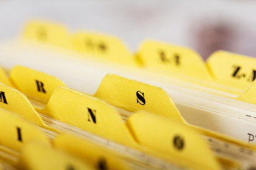 Close up of alphabetical index cards in box