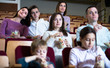 © JackF - Numerous audience eating popcorn and watching a movie