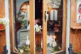 Fototapeta Psy - The charming couple in love sitting in the restaurant