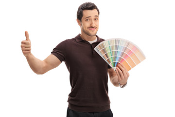 Poster - Man holding color swatch and making thumb up sign