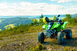 © jozefklopacka - Green Quad in landscape on mountain road.