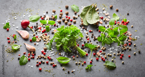 Naklejka na meble Herbs and spices on a black background