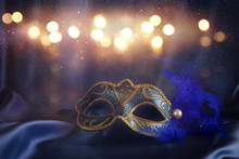 Elegant Venetian Mask On Blue Silk Background