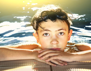 Wall Mural - boy in water galsses close up portrait in swimming pool