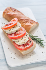 Wall Mural - Sandwich with sliced fresh tomatoes and mozzarella