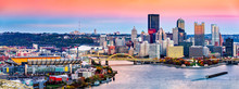 Pittsburgh, Pennsylvania Skyline At Sunset And The Famous Baseball Stadium Across Allegheny River