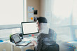 © ZeroThree - Asian man working at a comptuer