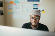 © ZeroThree - African American Man Working On His Computer