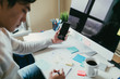 © ZeroThree - Using Phone And Taking Notes