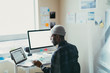 © ZeroThree - African American Man Working At His Desk