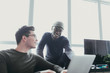 © ZeroThree - Two men collaborting over a laptop
