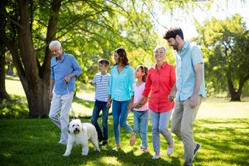 Wall Mural - Happy family enjoying in park