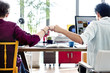 © Rawpixel.com - Fist Bump Corporate Colleagues Teamwork Office Concept