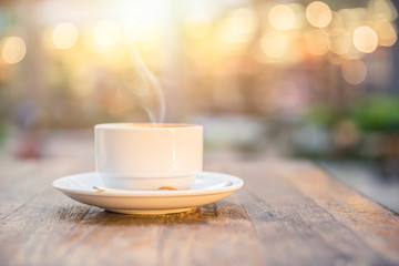 smoke hot drink coffee cup in the morning on wooden table.