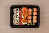 Fototapeta Storczyk - Set of assorted sushi kept in a black box