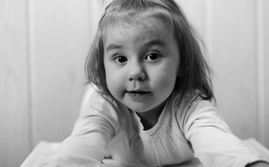 black and white photo of  kid smiling and have fun white backgro