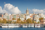 Fototapeta Sawanna - Sunny view of Bosphorus with excursion boats and Galata Tower, Istanbul, Turkey.
