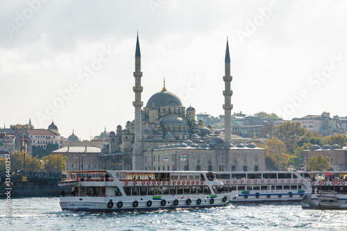Sunny view of Bosphorus with excursion boats and Blue mosque, Istanbul, Turkey Poster