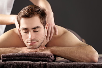 Canvas Print - Man having massage in spa salon