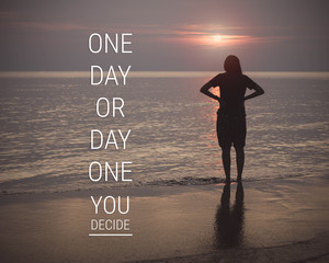 Inspirational quote on silhouette of woman walking on the beach