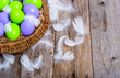 Traditional easter eggs in the basket on wooden background