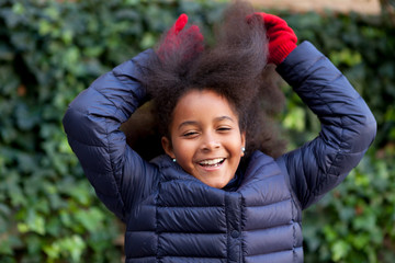 Wall Mural - Pretty girl with long afro hair in the garden