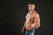© okfoto - Super handsome man with muscular body, fitness model at studio
